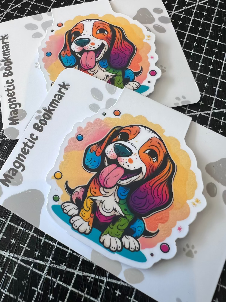 Colorful dog illustration on a magnetic bookmark with a grid background