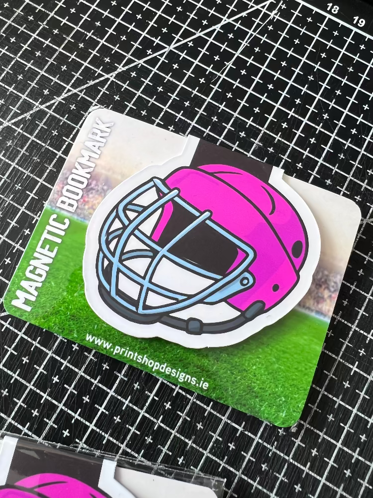 Magnetic bookmark with pink helmet design on a grid background