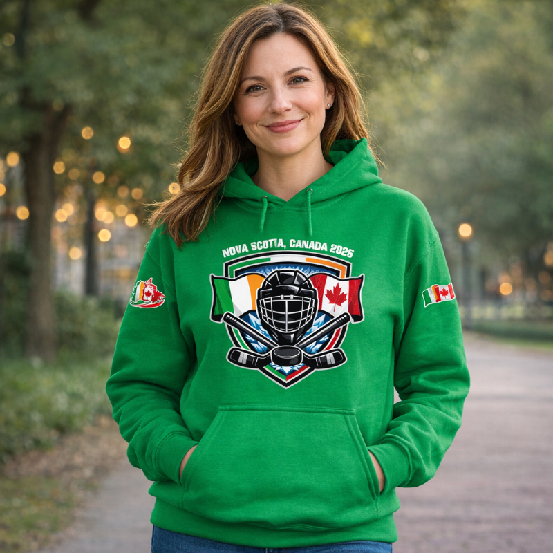 Woman wearing a green hoodie with a sports-themed design, standing outdoors.