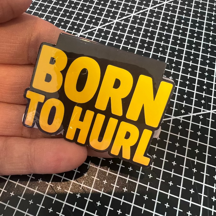 bookmark  'Born to Hurl' text held over a grid background