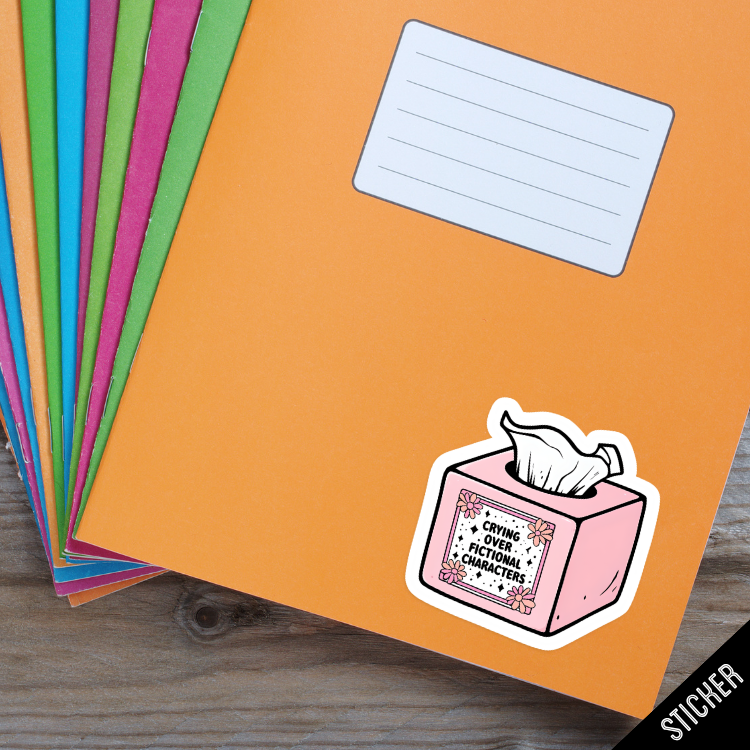 Colorful paper sheets with a sticker of a tissue box and text on an orange sheet.