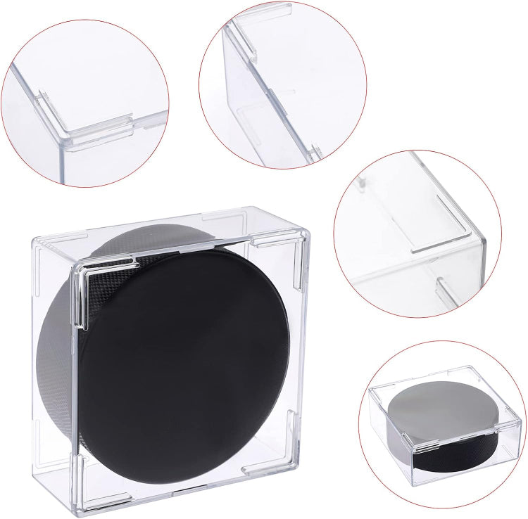 Clear acrylic display box with a black round object, showing different angles on a white background.