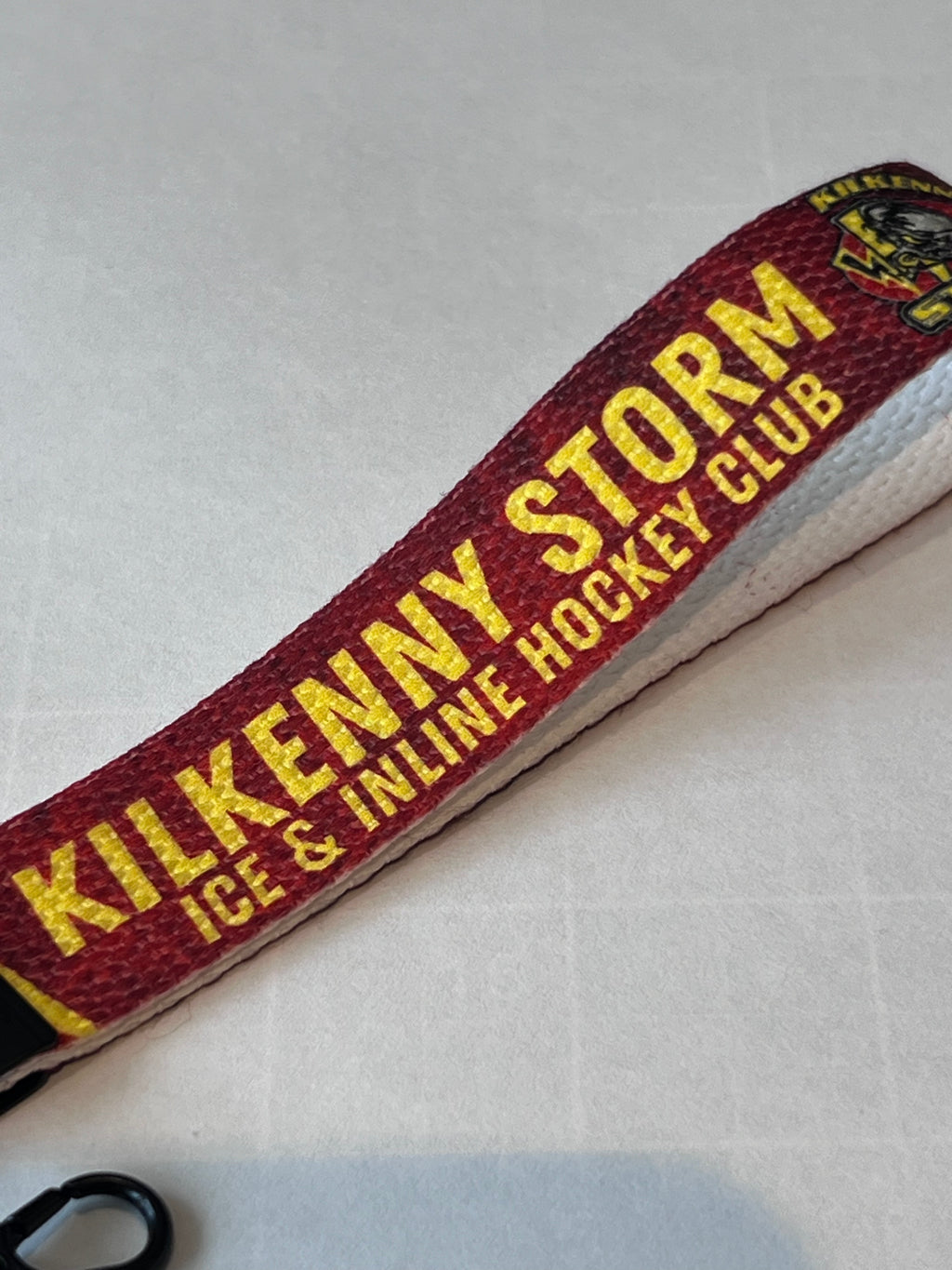 Kilkenny Storm Ice & Inline Hockey Club strap on a light gray background