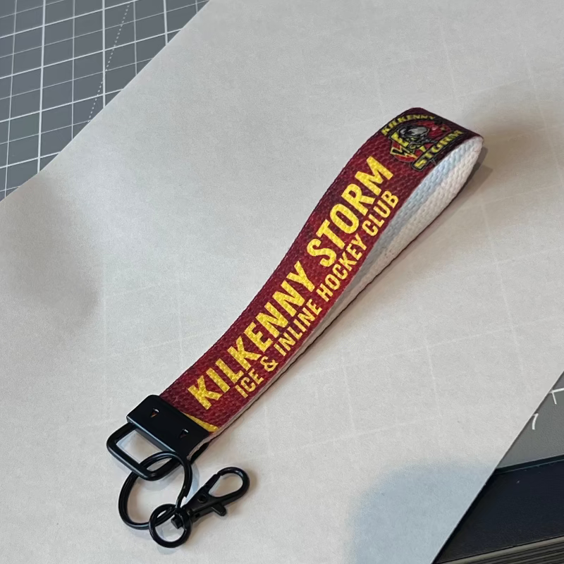 Keychain with 'Kilkenny Storm Club' text on a white surface