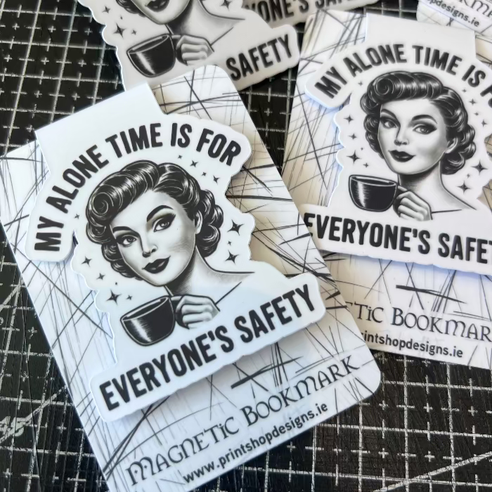 Stickers with a design of a woman holding a coffee cup and text on a black grid background.