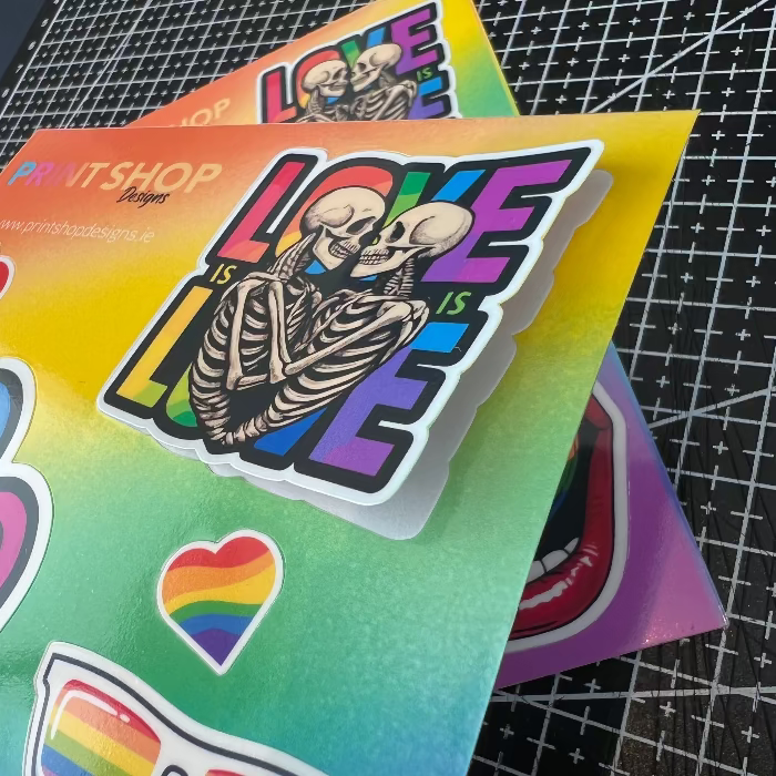Colorful stickers with skeletons and rainbow hearts.