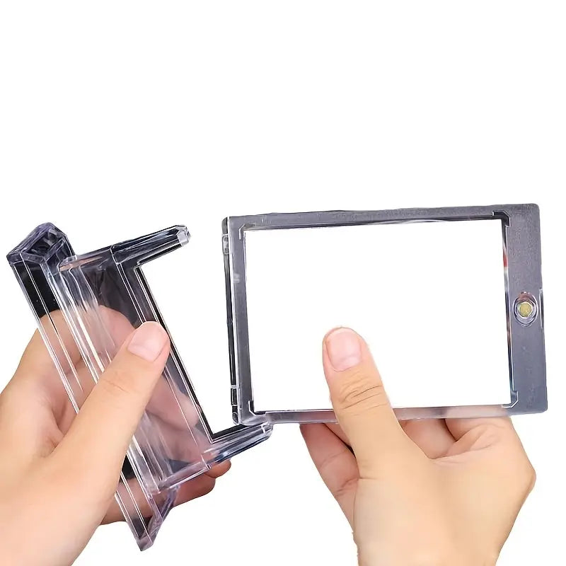 Clear plastic frames held by hands against a white background