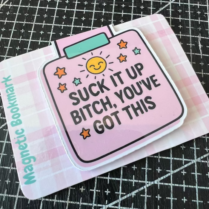 Magnetic bookmark with motivational quote on a grid background
